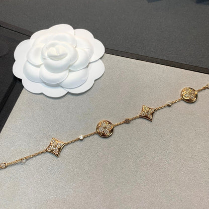 [LUXE] PULSERA DE ORO CON DIAMANTES Y ESTRELLA Y SOL, 4 MOTIVOS