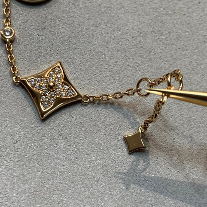 [LUXE] PULSERA DE ORO CON DIAMANTES Y ESTRELLA Y SOL, 4 MOTIVOS