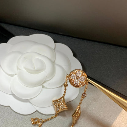 [LUXE] PULSERA DE ORO CON DIAMANTES Y ESTRELLA Y SOL, 4 MOTIVOS