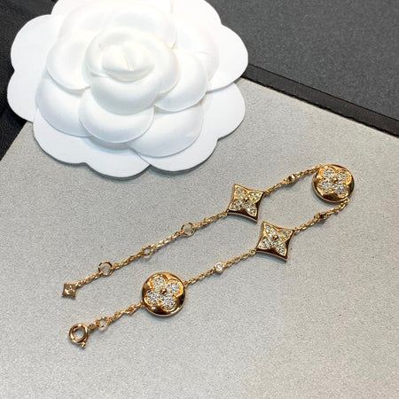 [LUXE] PULSERA DE ORO CON DIAMANTES Y ESTRELLA Y SOL, 4 MOTIVOS