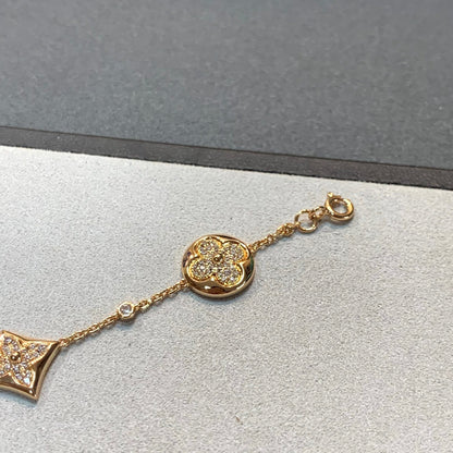 [LUXE] PULSERA DE ORO CON DIAMANTES Y ESTRELLA Y SOL, 4 MOTIVOS