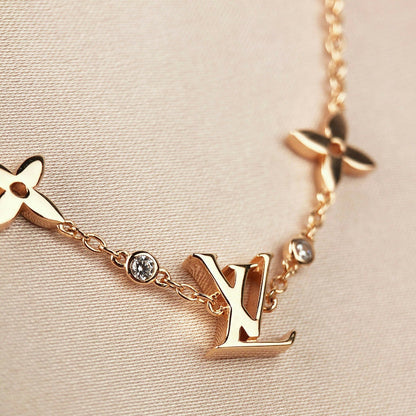 [LUXE]PULSERA DE ORO CON 7 MOTIVOS DE ESTRELLA Y SOL