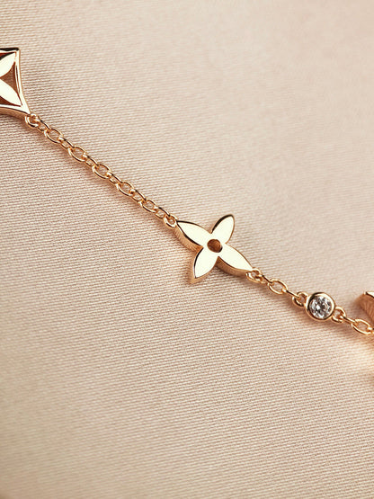 [LUXE]PULSERA DE ORO CON 7 MOTIVOS DE ESTRELLA Y SOL
