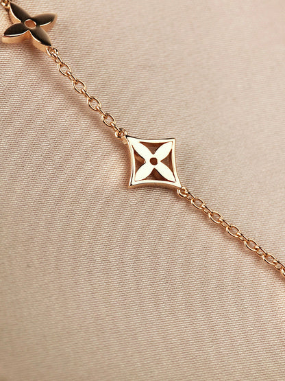 [LUXE]PULSERA DE ORO CON 7 MOTIVOS DE ESTRELLA Y SOL