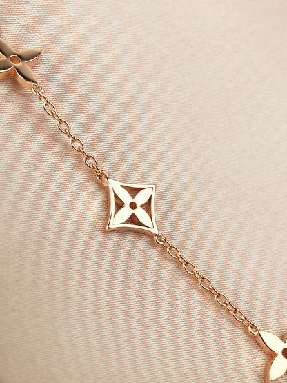 [LUXE]PULSERA DE ORO CON 7 MOTIVOS DE ESTRELLA Y SOL