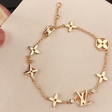 [LUXE]PULSERA DE ORO CON 7 MOTIVOS DE ESTRELLA Y SOL