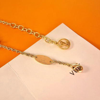 PULSERA DE ORO CON MOTIVO DE ESTRELLA Y LOGO [LUXE]