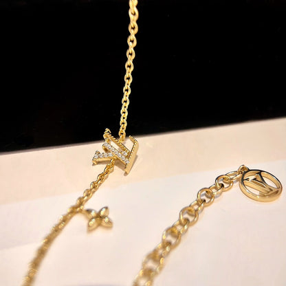 PULSERA DE ORO CON MOTIVO DE ESTRELLA Y LOGO [LUXE]