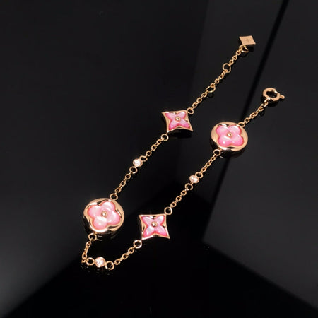 [LUXE] PULSERA DE ORO ROSA CON 4 MOTIVOS DE ESTRELLAS Y SOLES 
