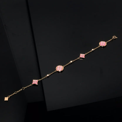 [LUXE] PULSERA DE ORO ROSA CON 4 MOTIVOS DE ESTRELLAS Y SOLES 