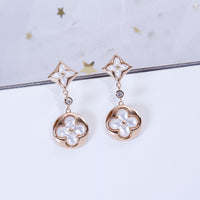 [LUXE] PENDIENTES DE LONGITUD DE MOPA EN ORO ROSA CON ESTRELLA Y SOL
