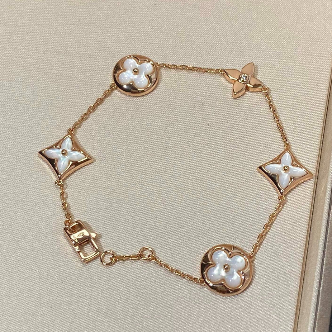 [LUXE] PULSERA DE ORO ROSA CON 5 MOTIVOS DE ESTRELLAS Y SOLES