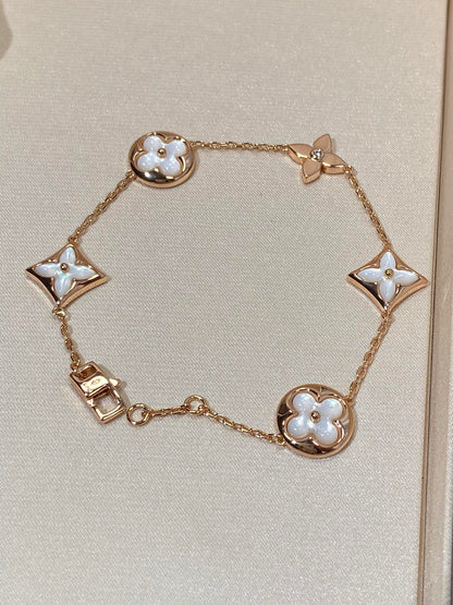 [LUXE] PULSERA DE ORO ROSA CON 5 MOTIVOS DE ESTRELLAS Y SOLES