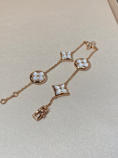 [LUXE] PULSERA DE ORO ROSA CON 5 MOTIVOS DE ESTRELLAS Y SOLES