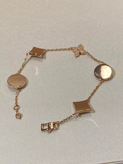 [LUXE] PULSERA DE ORO ROSA CON 5 MOTIVOS DE ESTRELLAS Y SOLES
