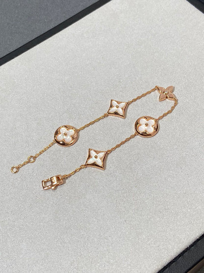 [LUXE] PULSERA DE ORO ROSA CON 5 MOTIVOS DE ESTRELLAS Y SOLES