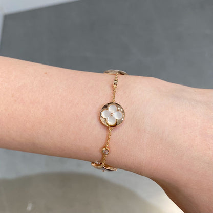 [LUXE] PULSERA DE ORO ROSA CON 4 MOTIVOS DE ESTRELLAS Y SOLES EN BLANCO 