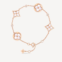 [LUXE] PULSERA DE ORO ROSA CON 4 MOTIVOS DE ESTRELLAS Y SOLES EN BLANCO 