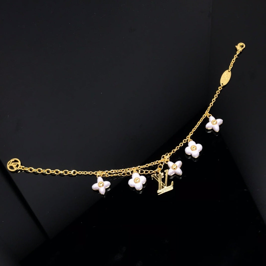 [LUXE]PULSERA DE ORO CON 6 MOTIVOS DE ESTRELLA Y SOL