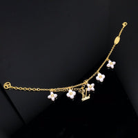 [LUXE]PULSERA DE ORO CON 6 MOTIVOS DE ESTRELLA Y SOL