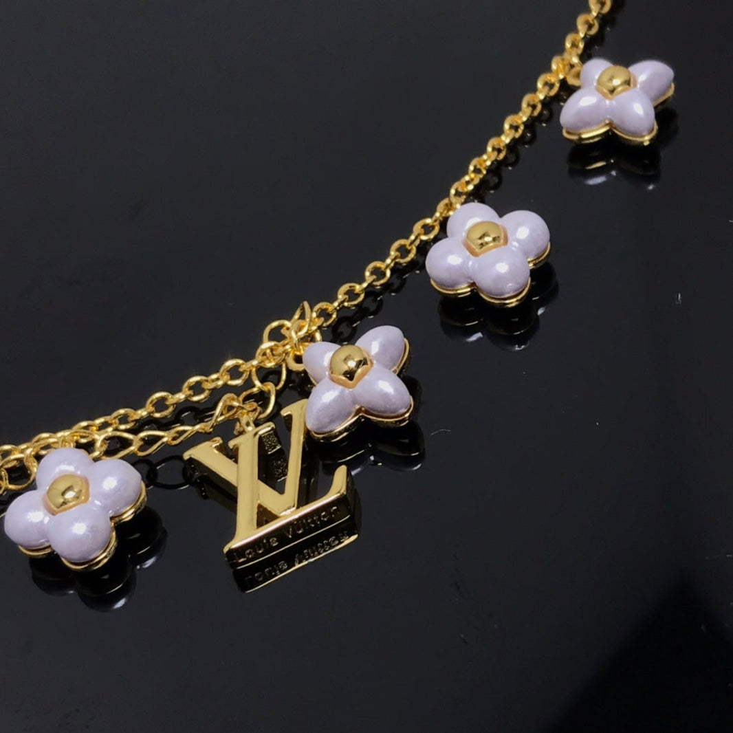[LUXE]PULSERA DE ORO CON 6 MOTIVOS DE ESTRELLA Y SOL