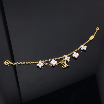 [LUXE]PULSERA DE ORO CON 6 MOTIVOS DE ESTRELLA Y SOL