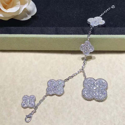 [LUXE] PULSERA DE PLATA Y DIAMANTES CON 6 MOTIVOS DE TRÉBOL