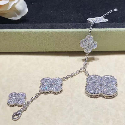 [LUXE] PULSERA DE PLATA Y DIAMANTES CON 6 MOTIVOS DE TRÉBOL