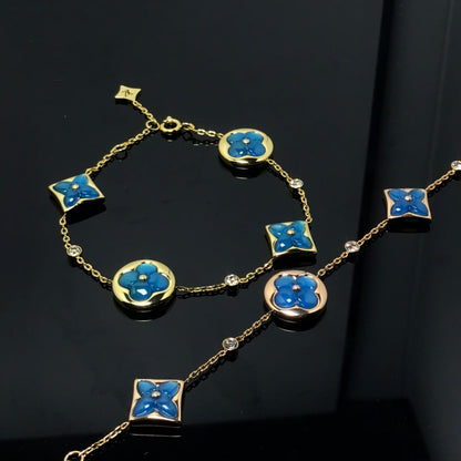[LUXE]PULSERA AZUL CON 4 MOTIVOS DE ESTRELLAS Y SOLES