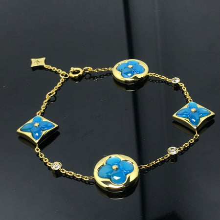 [LUXE]PULSERA AZUL CON 4 MOTIVOS DE ESTRELLAS Y SOLES
