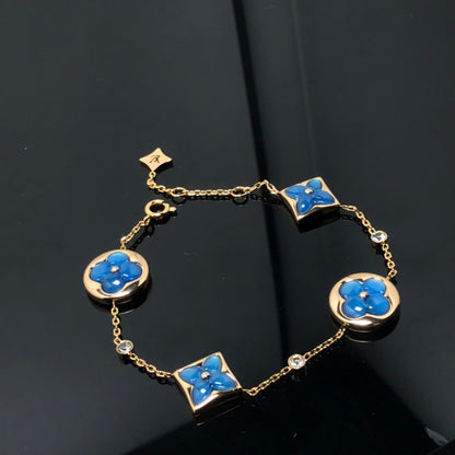 [LUXE]PULSERA AZUL CON 4 MOTIVOS DE ESTRELLAS Y SOLES